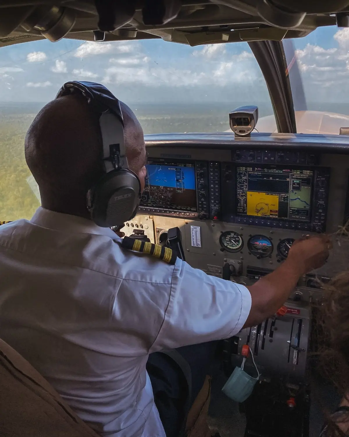 Captain at the controls over the Kenyan bush